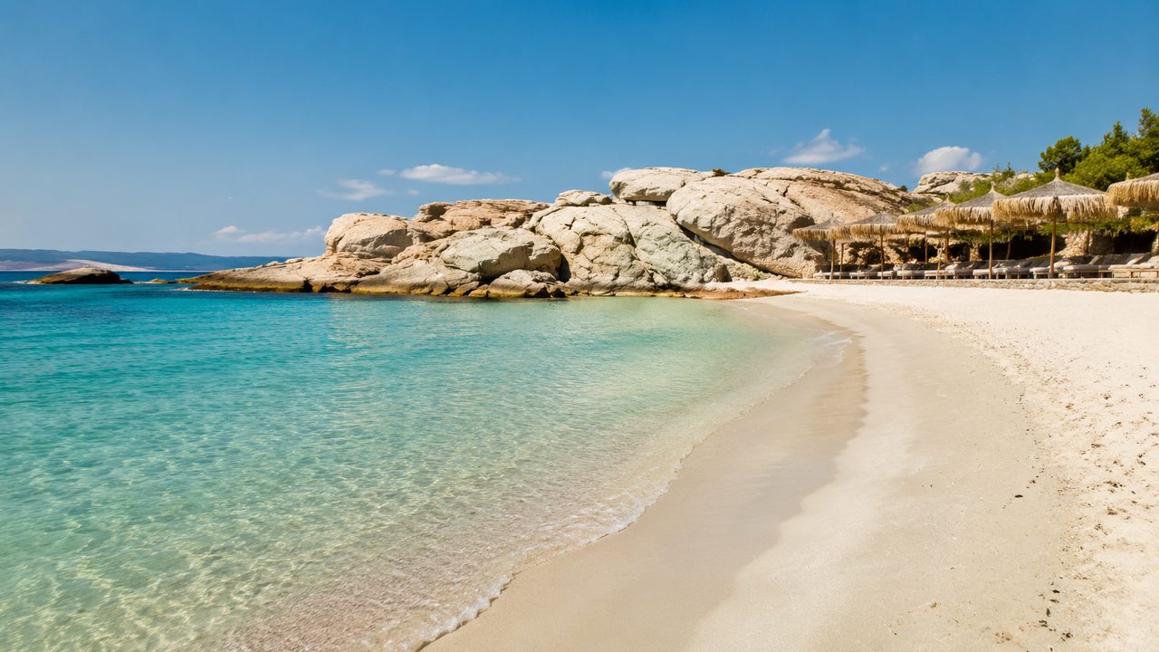 Kolymbithres Beach with distinctive granite formations and clear shallow water.